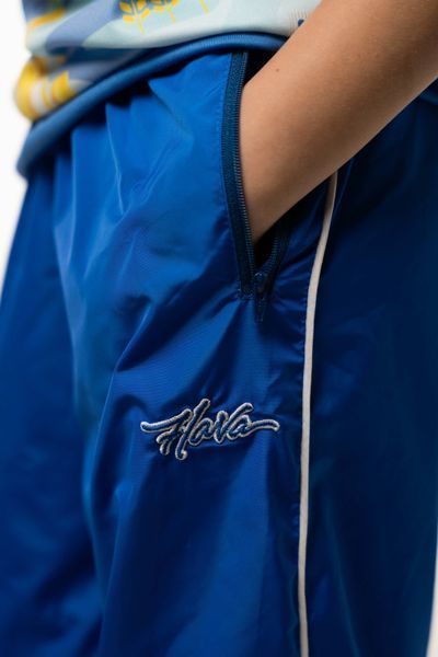 Спортивні штани Flava сині (плащівка з підкладкою та білим лампасом) дитячі 7949215 фото